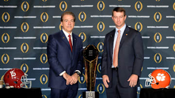 SCOTTSDALE, AZ - JANUARY 10: Head coach Nick Saban of the Alabama Crimson Tide (L) and head coach Dabo Swinney of the Clemson Tigers pose for a photo next to the National Championship trophy during the Head Coach Press Conference for the College Football Playoff National Championship at JW Marriott Scottsdale Camelback Inn on January 10, 2016 in Scottsdale, Arizona. (Photo by Jennifer Stewart/Getty Images)