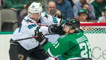 Nov 8, 2014; Dallas, TX, USA; San Jose Sharks defenseman Brent Burns (88) checks Dallas Stars left wing Antoine Roussel (21) during the second period at the American Airlines Center. Mandatory Credit: Jerome Miron-USA TODAY Sports