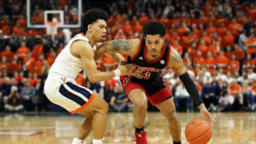 CHARLOTTESVILLE, VA - MARCH 07: Kihei Clark #0 of the Virginia Cavaliers defends Lamarr Kimble #0 of the Louisville Cardinals in the first half during a game at John Paul Jones Arena on March 7, 2020 in Charlottesville, Virginia. (Photo by Ryan M. Kelly/Getty Images)