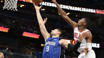 The Orlando Magic's Nikola Vucevic (9) has his shot rejected by the Chicago Bulls' Kris Dunn (32) and Cristiano Felicio at the Amway Center in Orlando, Fla., on Friday, Nov. 3, 2017. The Bulls won, 105-83. (Stephen M. Dowell/Orlando Sentinel/TNS via Getty Images)