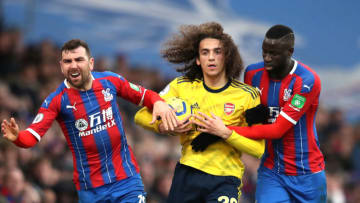 LONDON, ENGLAND - JANUARY 11: James McArthur of Crystal Palace and Cheikhou Kouyate of Crystal Palace grab Matteo Guendouzi of Arsenal during the Premier League match between Crystal Palace and Arsenal FC at Selhurst Park on January 11, 2020 in London, United Kingdom. (Photo by Alex Pantling/Getty Images)