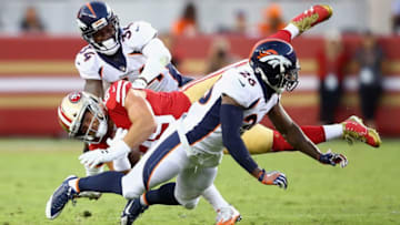 SANTA CLARA, CA - AUGUST 19: Vance McDonald #89 of the San Francisco 49ers is tackled by Will Parks #34 and Darian Stewart #26 of the Denver Broncos at Levis Stadium on August 19, 2017 in Santa Clara, California. (Photo by Ezra Shaw/Getty Images)