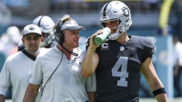 MIAMI, FL - SEPTEMBER 23: Derek Carr #4 of the Oakland Raiders and head coach Jon Gruden of the Oakland Raiders during the second quarter against Miami Dolphins at Hard Rock Stadium on September 23, 2018 in Miami, Florida. (Photo by Mark Brown/Getty Images)