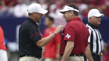 Sep 3, 2016; Houston, TX, USA; Houston Cougars head coach Tom Herman (left) and Oklahoma Sooners head coach Bob Stoops (right) talk before a game at NRG Stadium. Mandatory Credit: Troy Taormina-USA TODAY Sports