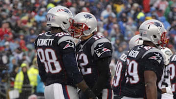 Dec 24, 2016; Foxborough, MA, USA; New England Patriots tight end Martellus Bennett (88) celebrates with quarterback Tom Brady (12) after a touchdown pass against the New York Jets in the first quarter at Gillette Stadium. Mandatory Credit: David Butler II-USA TODAY Sports