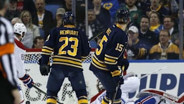 Mar 16, 2016; Buffalo, NY, USA; Buffalo Sabres defenseman Zach Bogosian (47) (not shown) scores on Montreal Canadiens goalie Ben Scrivens (40) as center Sam Reinhart (23)and center Jack Eichel (15) look on during the first period at First Niagara Center. Mandatory Credit: Kevin Hoffman-USA TODAY Sports