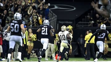 Sep 11, 2016; New Orleans, LA, USA; New Orleans Saints wide receiver Brandin Cooks (10) runs past Oakland Raiders defensive back Reggie Nelson (27) and defensive back Sean Smith (21) and outside linebacker Ben Heeney (50) for a 98 yard touchdown during the third quarter of a game at the Mercedes-Benz Superdome. The Raiders defeated the Saints 35-34. Mandatory Credit: Derick E. Hingle-USA TODAY Sports
