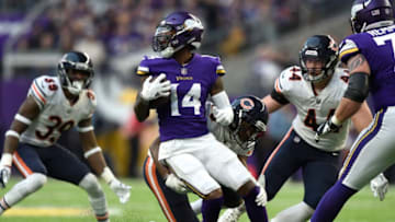 MINNEAPOLIS, MN - DECEMBER 31: Stefon Diggs #14 of the Minnesota Vikings attempts to spin away from a Chicago Bears defender in the fourth quarter of the game on December 31, 2017 at U.S. Bank Stadium in Minneapolis, Minnesota. (Photo by Hannah Foslien/Getty Images)