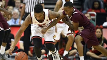 Dec 10, 2016; Louisville, KY, USA; Texas Southern Tigers guard Demontrae Jefferson (3) scrambles for a loose ball with Louisville Cardinals guard Donovan Mitchell (45) during the first half at KFC Yum! Center. Mandatory Credit: Jamie Rhodes-USA TODAY Sports