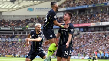 BRIGHTON, ENGLAND - MAY 12: Aymeric Laporte of Manchester City celebrates with teammate Riyad Mahrez after scoring his team's second goal during the Premier League match between Brighton & Hove Albion and Manchester City at American Express Community Stadium on May 12, 2019 in Brighton, United Kingdom. (Photo by Mike Hewitt/Getty Images)