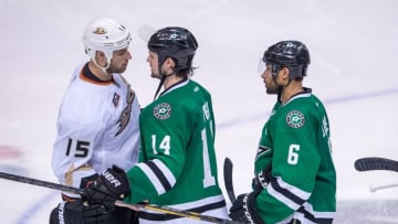 Apr 27, 2014; Dallas, TX, USA; Dallas Stars left wing Jamie Benn (14) congratulates Anaheim Ducks center Ryan Getzlaf (15) after the overtime period in game six of the first round of the 2014 Stanley Cup Playoffs at American Airlines Center. The Ducks defeated the Stars 5-4 and win the series 4-2. Mandatory Credit: Jerome Miron-USA TODAY Sports