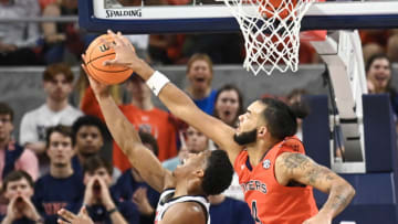 March MadnessFeb 22, 2023; Auburn, Alabama, USA; Auburn Tigers forward Johni Broome (4) blocks a shot by Mississippi Rebels guard Matthew Murrell (11) during the second half at Neville Arena. Mandatory Credit: Julie Bennett-USA TODAY Sports