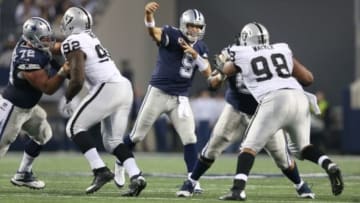Nov 28, 2013; Arlington, TX, USA; Dallas Cowboys quarterback Tony Romo (9) throws in the pocket against the Oakland Raiders during a NFL football game on Thanksgiving at AT&T Stadium. The Cowboys beat the Raiders 31-24. Mandatory Credit: Matthew Emmons-USA TODAY Sports