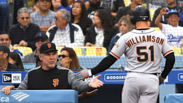 LOS ANGELES, CA - JUNE 16: Mac Williamson #51 is greeted at the dugout by manager Bruce Bochy #15 of the San Francisco Giants after scoring a run in the fifth inning of the game at Dodger Stadium on June 16, 2018 in Los Angeles, California. (Photo by Jayne Kamin-Oncea/Getty Images)