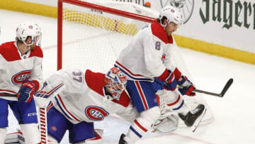 BUFFALO, NY - OCTOBER 09: Ben Chiarot #8 of the Montreal Canadiens assists goalie Keith Kinkaid #37 of the Montreal Canadiens to defend their net against the Buffalo Sabres during the third period at KeyBank Center on October 9, 2019 in Buffalo, New York. (Photo by Nicholas T. LoVerde/Getty Images)