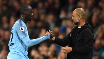 MANCHESTER, ENGLAND - MAY 09: Yaya Toure of Manchester City shakes hands wtih Josep Guardiola, Manager of Manchester City after he is subbed off during the Premier League match between Manchester City and Brighton and Hove Albion at Etihad Stadium on May 9, 2018 in Manchester, England. (Photo by Gareth Copley/Getty Images)