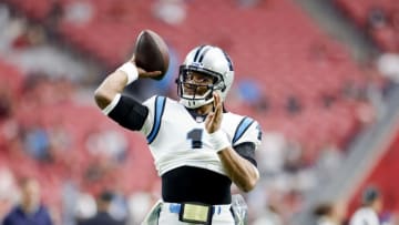 Auburn footballNov 14, 2021; Glendale, Arizona, USA; Carolina Panthers quarterback Cam Newton (1) warms up prior to the game against the Arizona Cardinals at State Farm Stadium. Mandatory Credit: Douglas DeFelice-USA TODAY Sports