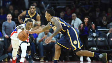 Jan 3, 2017; Auburn Hills, MI, USA; Detroit Pistons guard Kentavious Caldwell-Pope (5) and Indiana Pacers guard Jeff Teague (44) reach for a lose ball during the fourth quarter at The Palace of Auburn Hills. Mandatory Credit: Tim Fuller-USA TODAY Sports