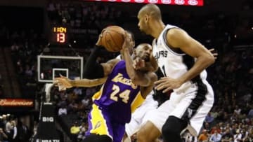 Jan 9, 2013; San Antonio, TX, USA; Los Angeles Lakers guard Kobe Bryant (24) drives to the basket against San Antonio Spurs forward Tim Duncan (right) during the first half at the AT&T Center. Mandatory Credit: Soobum Im-USA TODAY Sports
