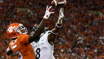 CLEMSON, SOUTH CAROLINA - SEPTEMBER 21: Defensive back Nafees Lyon #8 of the Charlotte 49ers breaks up a pass intended for wide receiver Tee Higgins #5 of the Clemson Tigers in the end zone during the first quarter of their football game at Memorial Stadium on September 21, 2019 in Clemson, South Carolina. (Photo by Mike Comer/Getty Images)