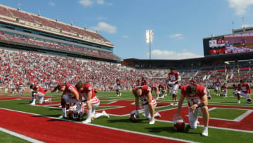 Oklahoma players pray before a spring football game for the University of Oklahoma Sooners (OU) at Gaylord Family-Oklahoma Memorial Stadium in Norman, Okla., Saturday, April 24, 2021.