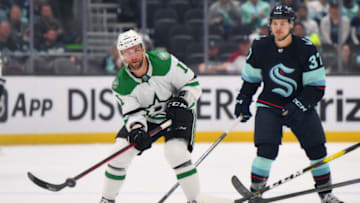 May 9, 2023; Seattle, Washington, USA; Dallas Stars center Luke Glendening (11) passes the puck against the Seattle Kraken during the third period in game four of the second round of the 2023 Stanley Cup Playoffs at Climate Pledge Arena. Mandatory Credit: Steven Bisig-USA TODAY Sports