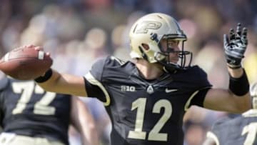 Sep 27, 2014; West Lafayette, IN, USA; Purdue Boilermakers quarterback Austin Appleby (12) throws a pass during the second half at Ross Ade Stadium against the Iowa Hawkeyes. The Iowa Hawkeyes beat the Purdue Boilermakers 24 to 10. Mandatory Credit: Marc Lebryk-USA TODAY Sports