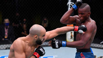 LAS VEGAS, NEVADA - SEPTEMBER 12: (L-R) Ottman Azaitar of Germany punches Khama Worthy in a lightweight fight during the UFC Fight Night event at UFC APEX on September 12, 2020 in Las Vegas, Nevada. (Photo by Jeff Bottari/Zuffa LLC)