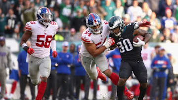 PHILADELPHIA, PA - NOVEMBER 25: Running back Corey Clement #30 of the Philadelphia Eagles carries the ball against outside linebacker Olivier Vernon #54 of the New York Giants during the fourth quarter at Lincoln Financial Field on November 25, 2018 in Philadelphia, Pennsylvania. (Photo by Mitchell Leff/Getty Images)