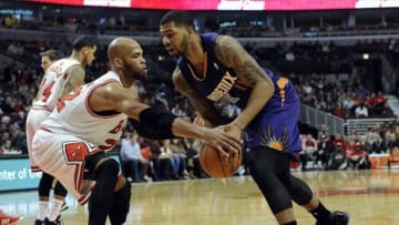 Jan 7, 2014; Chicago, IL, USA; Phoenix Suns power forward Markieff Morris (right) is defended by Chicago Bulls power forward Taj Gibson (22) during the first quarter at the United Center. Mandatory Credit: David Banks-USA TODAY Sports