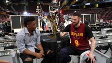 CLEVELAND, OH - JUNE 5: Donovan Mitchell of the Utah Jazz interviews Kevin Love #0 of the Cleveland Cavaliers during practice and media availability as part of the 2018 NBA Finals on June 5, 2018 at Quicken Loans Arena in Cleveland, Ohio. Copyright 2018 NBAE (Photo by Joe Murphy/NBAE via Getty Images)