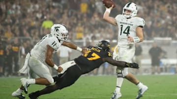 TEMPE, AZ - SEPTEMBER 08: Quarterback Brian Lewerke #14 of the Michigan State Spartans throws a pass under pressure from linebacker Darien Butler #37 of the Arizona State Sun Devils during the first half of the college football game against the Arizona State Sun Devils at Sun Devil Stadium on September 8, 2018 in Tempe, Arizona. (Photo by Christian Petersen/Getty Images)