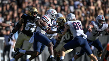 BOULDER, CO - OCTOBER 16: Wide receiver Anthony Simpson #25 of the Arizona Wildcats carries the ball against the Colorado Buffaloes at Folsom Field on October 16, 2021 in Boulder, Colorado. (Photo by Dustin Bradford/Getty Images)