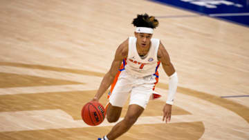 NASHVILLE, TN - MARCH 11: Tre Mann #1 of the Florida Gators dribbles against the Vanderbilt Commodores during the second half of their second round game in the SEC Men's Basketball Tournament at Bridgestone Arena on March 11, 2021 in Nashville, Tennessee. Florida defeats Vanderbilt 69-63. (Photo by Brett Carlsen/Getty Images)