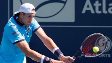 ATLANTA, GA - JULY 29: John Isner returns a backhand to Gilles Muller of Luxembourg during the BB