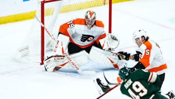 Dec 14, 2019; Saint Paul, MN, USA; Philadelphia Flyers goaltender Carter Hart (79) makes a save against Minnesota Wild center Victor Rask (49) in the third period at Xcel Energy Center. Mandatory Credit: David Berding-USA TODAY Sports