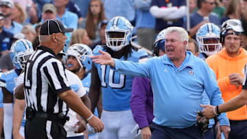 Sep 24, 2022; Chapel Hill, North Carolina, USA; North Carolina Tar Heels head coach Mack Brown reacts with the official in the third quarter at Kenan Memorial Stadium. Mandatory Credit: Bob Donnan-USA TODAY Sports