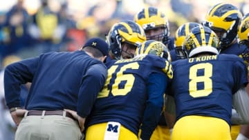 Apr 1, 2016; Ann Arbor, MI, USA; Michigan Wolverines head coach Jim Harbaugh jogs onto the field during the spring game at Michigan Stadium. Mandatory Credit: Rick Osentoski-USA TODAY Sports