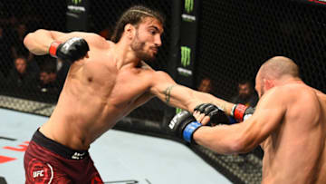 LIVERPOOL, ENGLAND - MAY 27: (L-R) Elias Theodorou of Canada punches in their middleweight bout during the UFC Fight Night event at ECHO Arena on May 27, 2018 in Liverpool, England. (Photo by Josh Hedges/Zuffa LLC/Zuffa LLC via Getty Images)