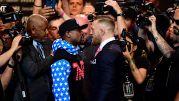 LOS ANGELES, CA - JULY 11: Floyd Mayweather Jr. and Conor McGregor stand face to face during the Floyd Mayweather Jr. v Conor McGregor World Press Tour at Staples Center on July 11, 2017 in Los Angeles, California. (Photo by Harry How/Getty Images)