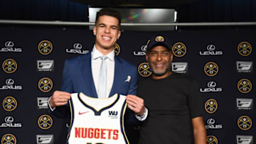 DENVER, CO - JUNE 22: Denver Nuggets draft pick, Michael Porter Jr., poses for a photo with his father during a press conference on June 22, 2018 at the Pepsi Center in Denver, Colorado. NOTE TO USER: User expressly acknowledges and agrees that, by downloading and/or using this photograph, user is consenting to the terms and conditions of the Getty Images License Agreement. Mandatory Copyright Notice: Copyright 2018 NBAE (Photo by Garrett Ellwood/NBAE via Getty Images)