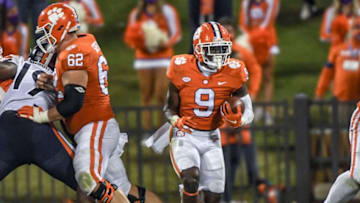 Clemson running back Travis Etienne(9) runs for a first down during the third quarter of the game with Virginia Saturday, October 3, 2020 at Memorial Stadium in Clemson, S.C.Clemson Virginia Ncaa Football