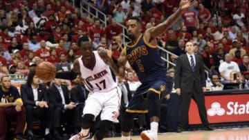 May 20, 2015; Atlanta, GA, USA; Atlanta Hawks guard Dennis Schroder (17) drives against Cleveland Cavaliers guard J.R. Smith (5) during the fourth quarter of game one of the Eastern Conference Finals of the NBA Playoffs at Philips Arena. Mandatory Credit: Dale Zanine-USA TODAY Sports