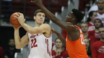Nov 29, 2016; Madison, WI, USA; Wisconsin Badgers forward Ethan Happ (22) looks to pass as Syracuse Orange forward Tyler Roberson (21) defends during the first half at the Kohl Center. Mandatory Credit: Mary Langenfeld-USA TODAY Sports