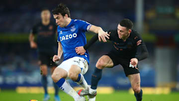 LIVERPOOL, ENGLAND - FEBRUARY 17: Seamus Coleman of Everton and Phil Foden of Manchester City during the Premier League match between Everton and Manchester City at Goodison Park on February 17, 2021 in Liverpool, United Kingdom. Sporting stadiums around the UK remain under strict restrictions due to the Coronavirus Pandemic as Government social distancing laws prohibit fans inside venues resulting in games being played behind closed doors. (Photo by Robbie Jay Barratt - AMA/Getty Images)