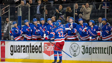 Feb 1, 2022; New York, New York, USA; New York Rangers left wing Alexis Lafreniere (13) celebrates after scoring a goal with teammates against the Florida Panthers during the second period at Madison Square Garden. Mandatory Credit: Vincent Carchietta-USA TODAY Sports