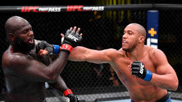 LAS VEGAS, NEVADA - FEBRUARY 27: In this handout image provided by UFC, (R-L) Ciryl Gane of France punches Jairzinho Rozenstruik of Suriname in a heavyweight bout during the UFC Fight Night event at UFC APEX on February 27, 2021 in Las Vegas, Nevada. (Photo by Jeff Bottari/Zuffa LLC via Getty Images)