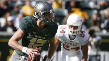 WACO, TX - OCTOBER 28: Charlie Brewer #12 of the Baylor Bears scrambles away from Malik Jefferson #46 and John Bonney #24 of the Texas Longhorns in the first half at McLane Stadium on October 28, 2017 in Waco, Texas. (Photo by Ron Jenkins/Getty Images)