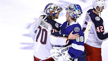 Joonas Korpisalo #70 of the Columbus Blue Jackets and Andrei Vasilevskiy #88 of the Tampa Bay Lightning (Photo by Elsa/Getty Images)