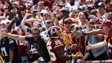 LANDOVER, MD - SEPTEMBER 10: Running back Chris Thompson #25 of the Washington Redskins celebrates with fans after scoring a touchdown against the Philadelphia Eagles at FedExField on September 10, 2017 in Landover, Maryland. (Photo by Rob Carr/Getty Images)